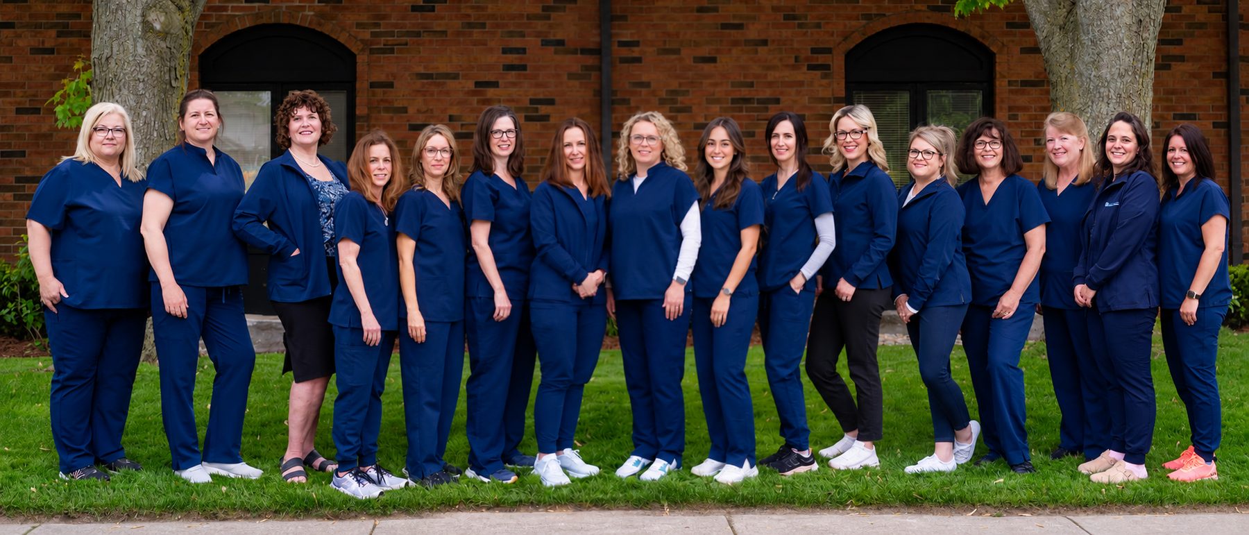 The Dearness Family Dentistry team standing together outside the South London office