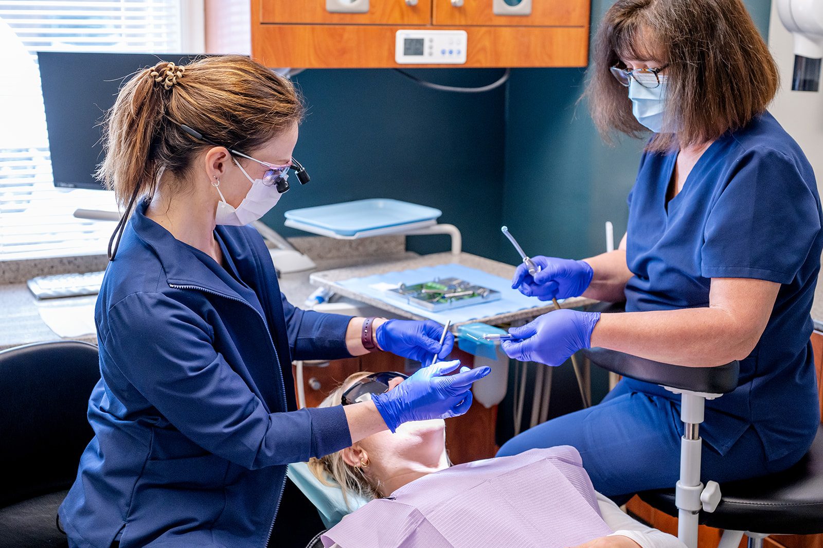 A dentist and assistant working together during a dental procedure